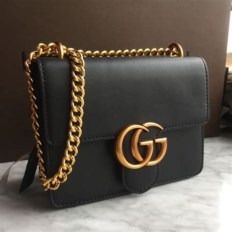 gucci black purse gold chain|Gucci shoulder bag chain.